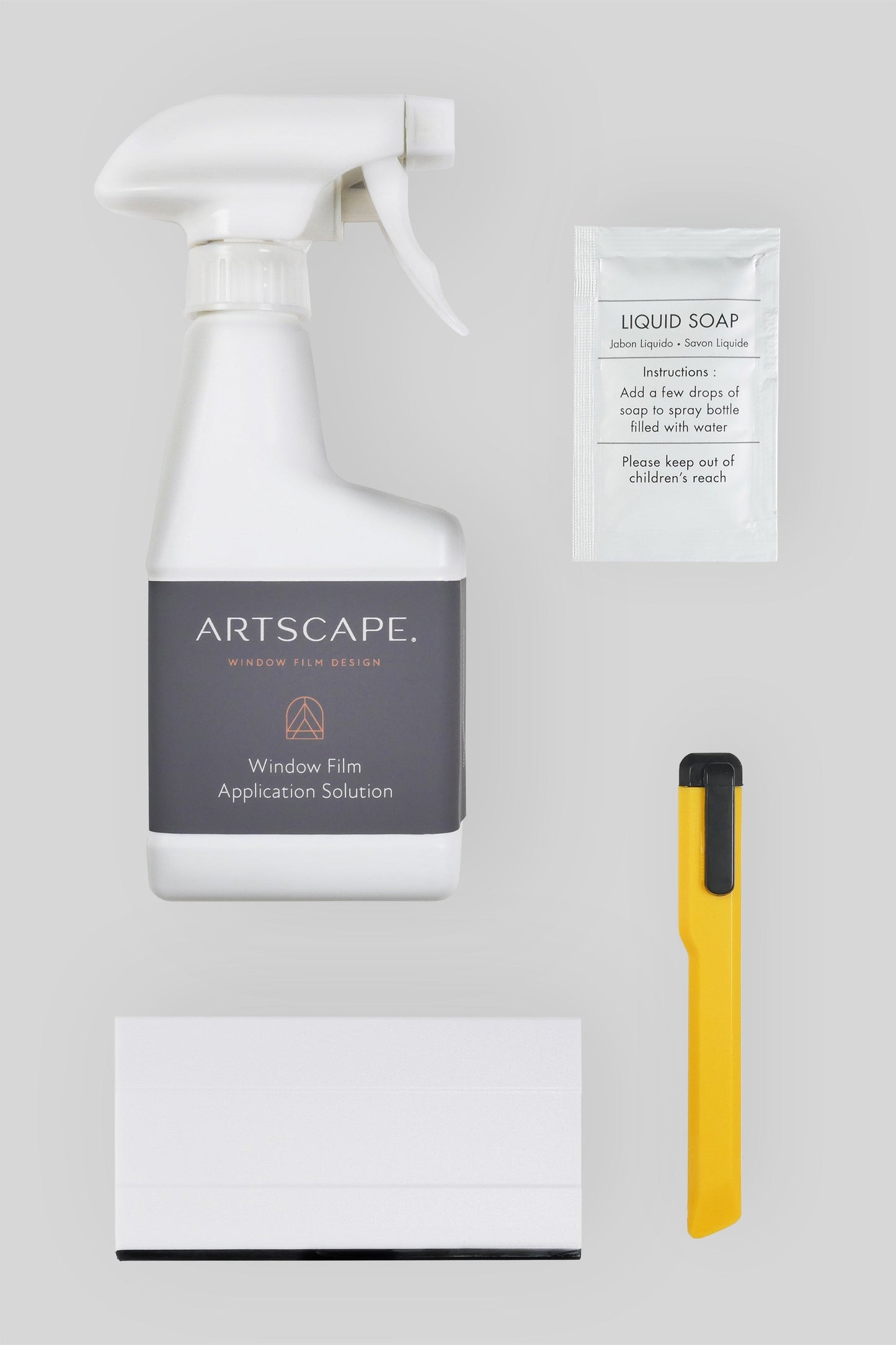 Film Application Kit comprising the following items: Water spray bottle (empty) Sachet of detergent Trimming Knife Squeegee Instruction sheet