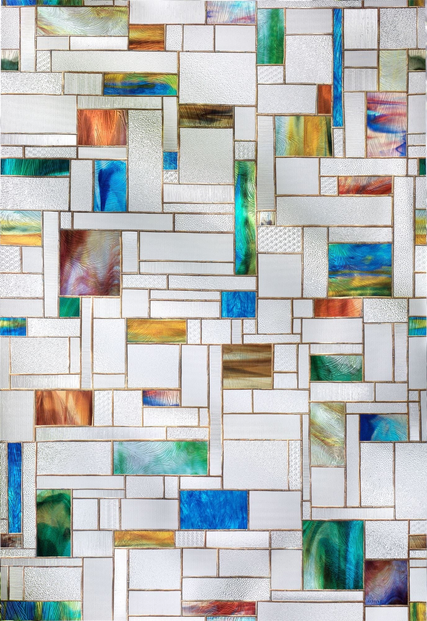 Modern square leaded glass window with pops of bright and saturated glass. The scale of this pattern lends itself well to a variety of window sizes and shapes. Really textured glass appearance.